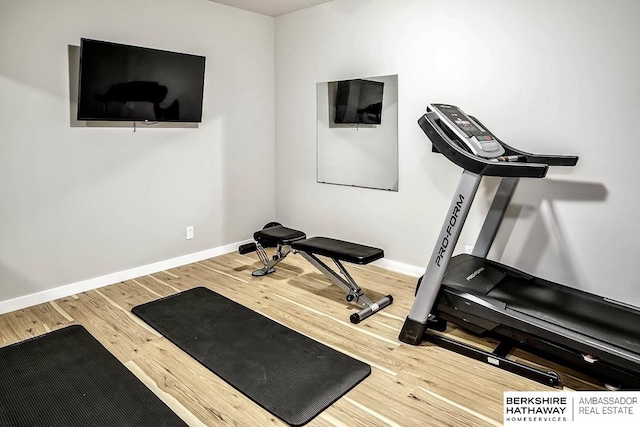 workout room with hardwood / wood-style floors