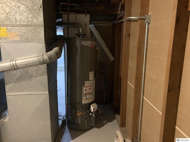 utility room with water heater