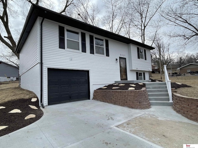 split foyer home featuring a garage