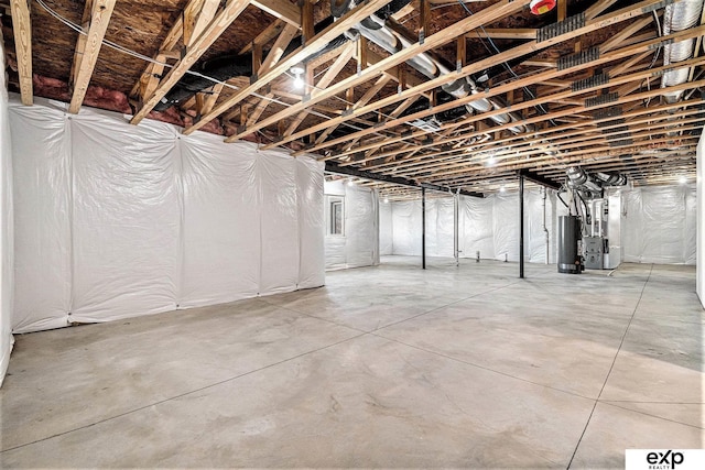 basement featuring heating unit and gas water heater