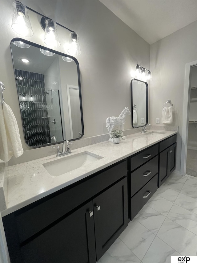 bathroom featuring vanity and tiled shower