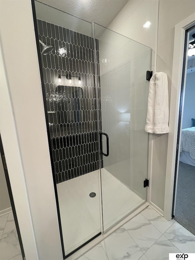 bathroom featuring an enclosed shower