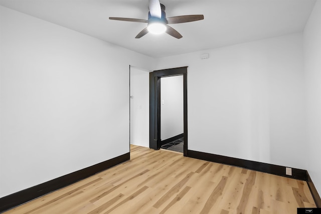 spare room with ceiling fan and light hardwood / wood-style floors