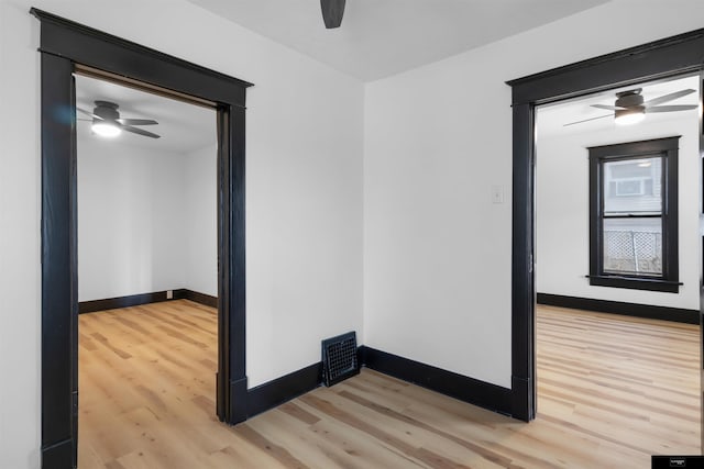 empty room with light hardwood / wood-style floors and ceiling fan