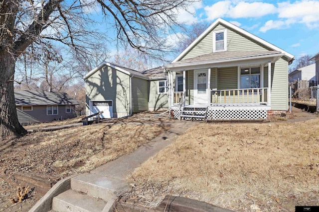 view of front of house with a garage and covered porch