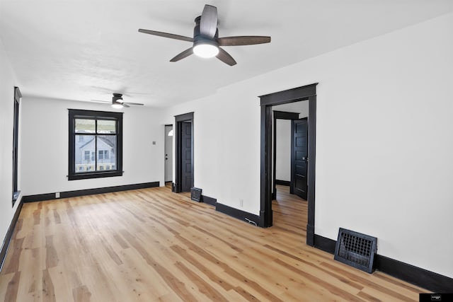 spare room with ceiling fan and light hardwood / wood-style floors