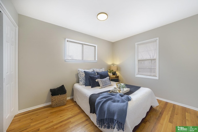 bedroom with hardwood / wood-style floors