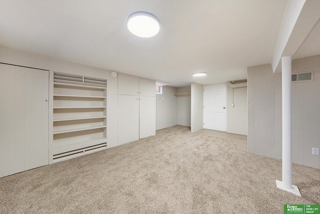 basement with light colored carpet