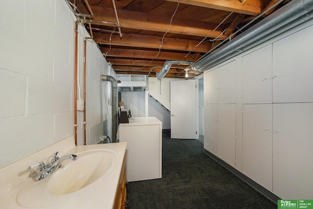 basement featuring washer / clothes dryer and sink