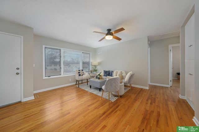 sitting room featuring light hardwood / wood-style floors and ceiling fan