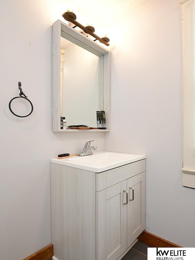 bathroom with vanity and hardwood / wood-style floors