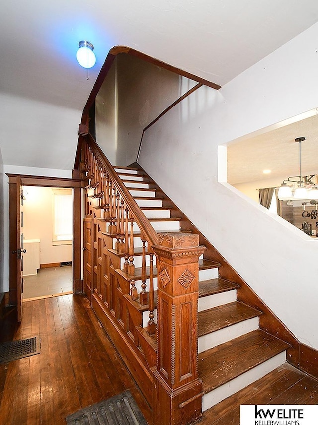 staircase featuring hardwood / wood-style floors