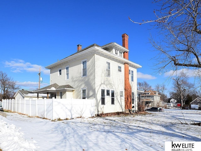 view of snow covered property