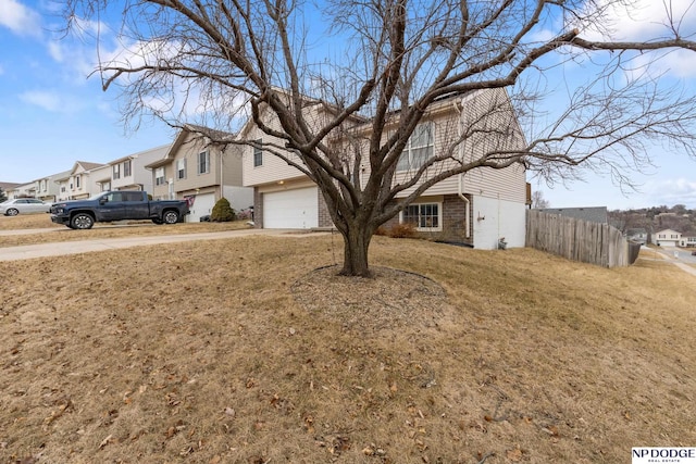 view of front facade featuring a garage and a front yard