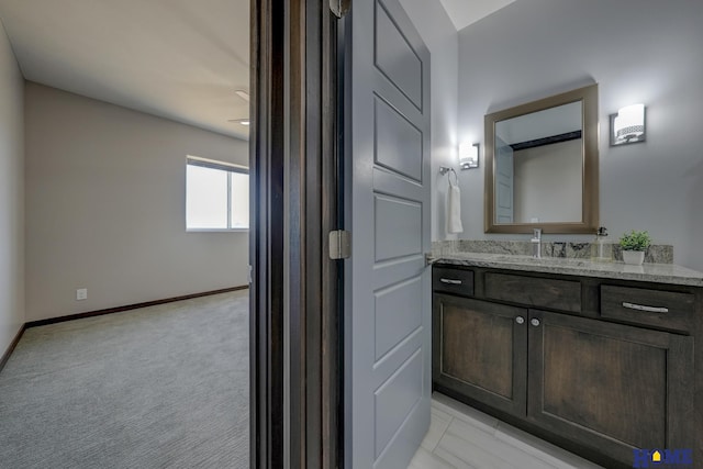 bathroom featuring vanity and baseboards