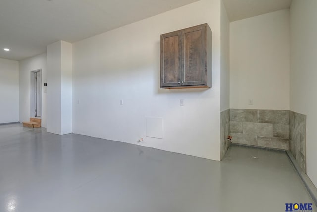 empty room featuring finished concrete flooring