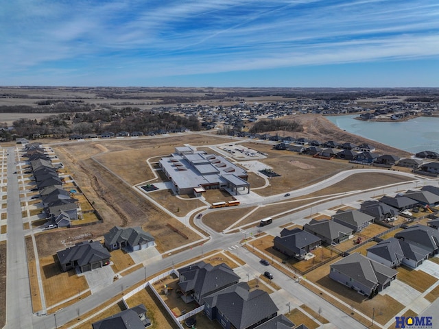 bird's eye view featuring a water view and a residential view