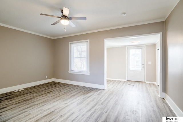 foyer featuring light hardwood / wood-style flooring, ornamental molding, and ceiling fan