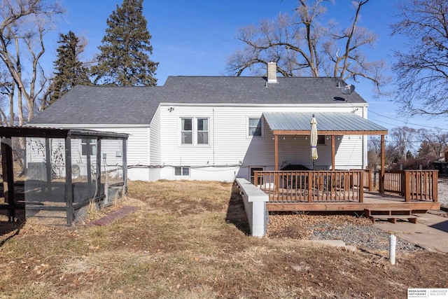 rear view of house with a wooden deck