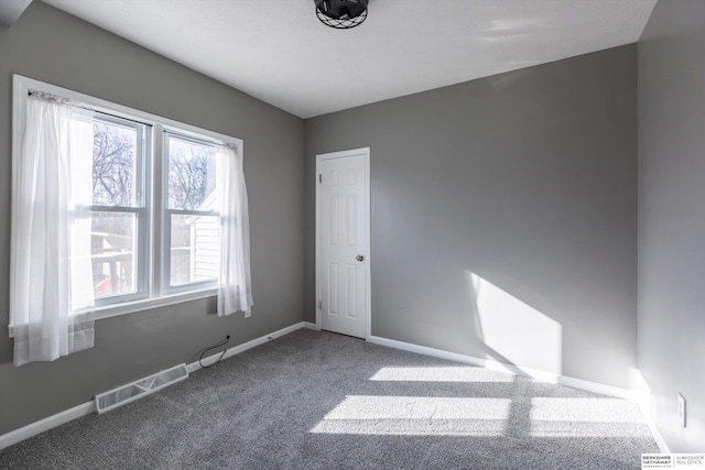 view of carpeted spare room