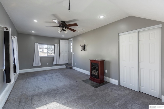 interior space featuring vaulted ceiling and ceiling fan