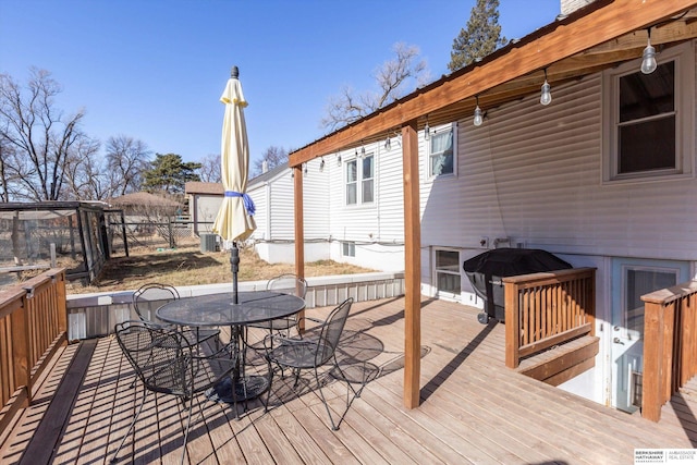 wooden deck featuring area for grilling