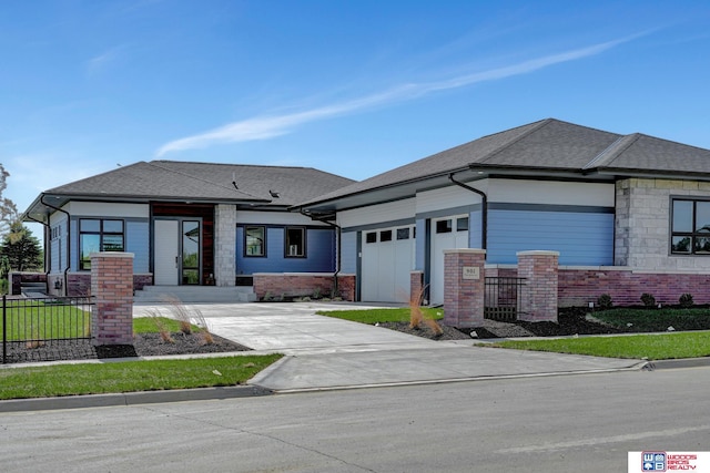 prairie-style house featuring a garage