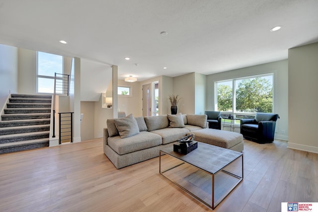 living room with light hardwood / wood-style flooring