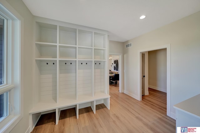 mudroom with light hardwood / wood-style flooring