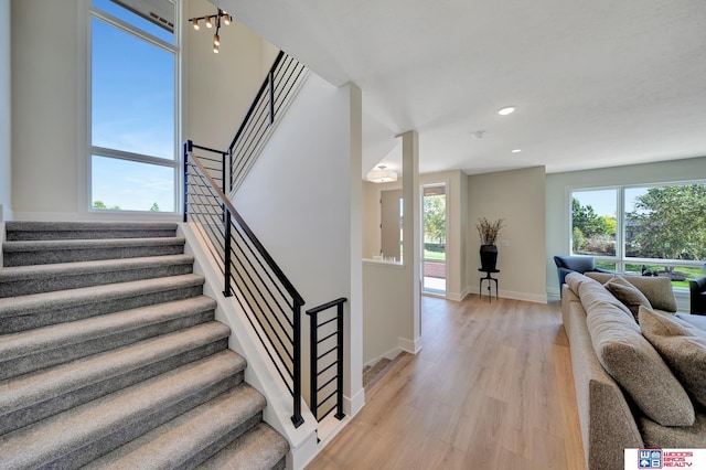 staircase featuring wood-type flooring