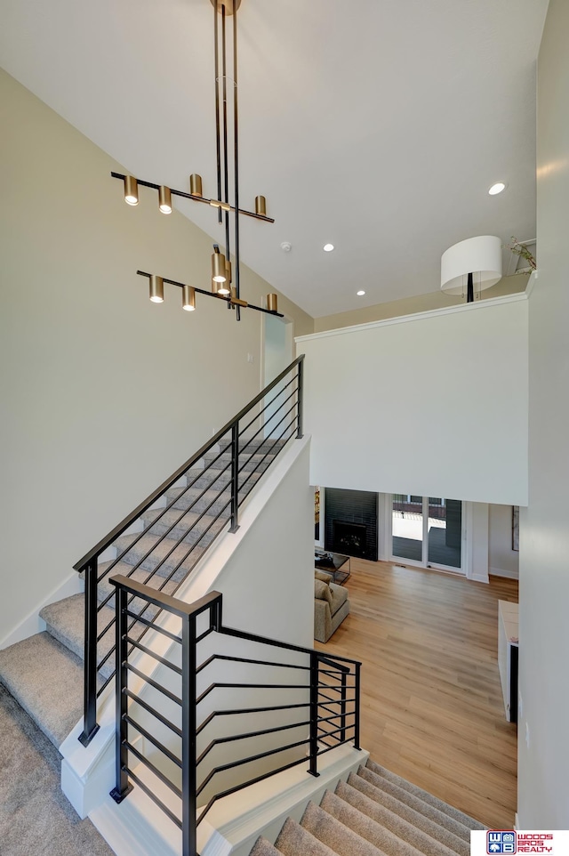 stairway featuring wood-type flooring