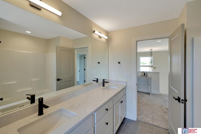 bathroom with vanity and tile patterned flooring