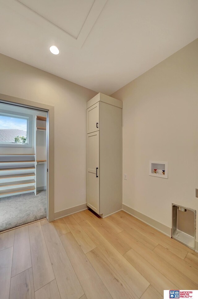 laundry area featuring washer hookup, light wood-style flooring, baseboards, and recessed lighting