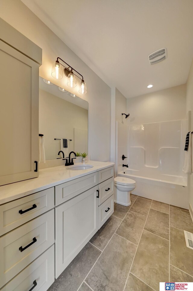 full bath featuring toilet, bathtub / shower combination, visible vents, and vanity