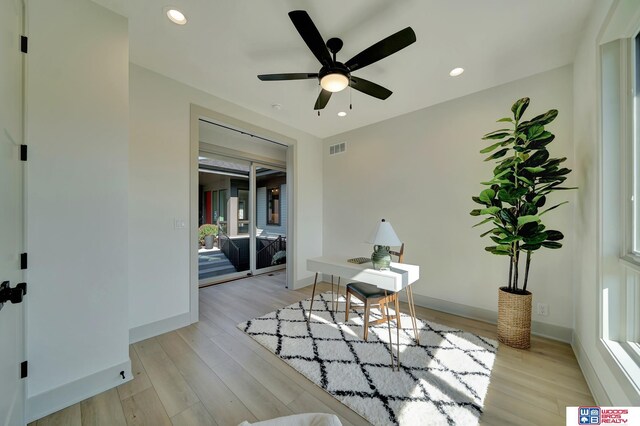 office with baseboards, light wood finished floors, and recessed lighting