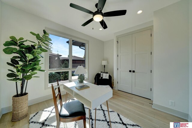 home office featuring baseboards, recessed lighting, a ceiling fan, and light wood-style floors