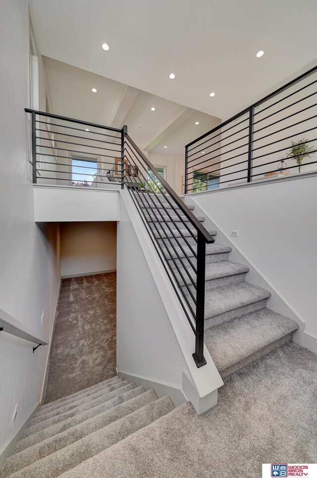 stairway featuring carpet and recessed lighting