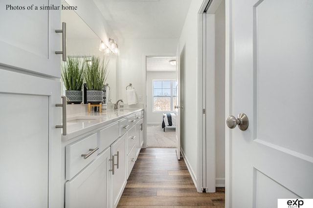 bathroom featuring vanity and hardwood / wood-style flooring