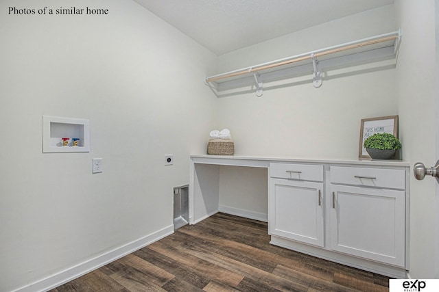 laundry room featuring electric dryer hookup, washer hookup, cabinets, and dark hardwood / wood-style floors