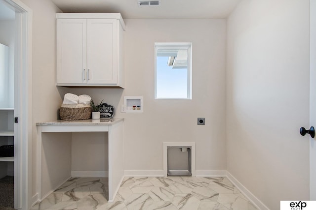 laundry area featuring cabinets, hookup for an electric dryer, and hookup for a washing machine