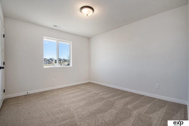 empty room featuring carpet flooring