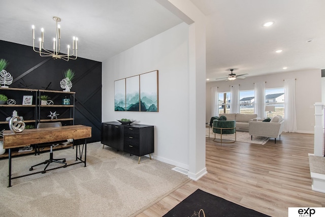 office area with an inviting chandelier and hardwood / wood-style floors