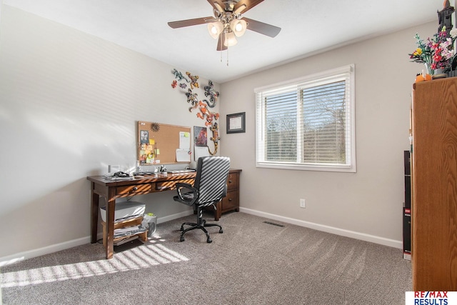 office space with carpet and ceiling fan