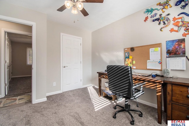 carpeted office space featuring lofted ceiling and ceiling fan