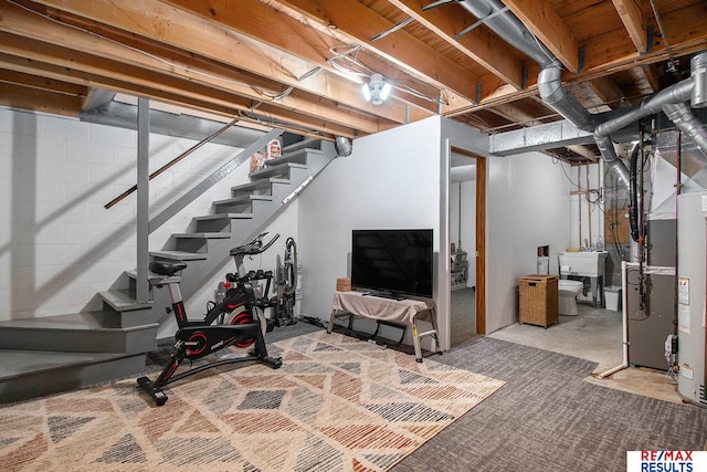 basement with sink and heating unit