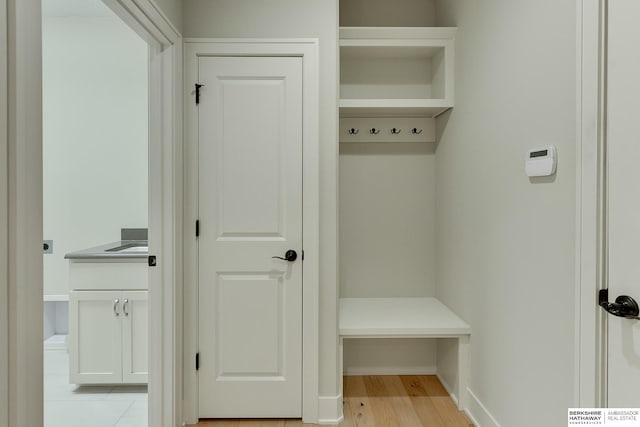 mudroom with light hardwood / wood-style floors