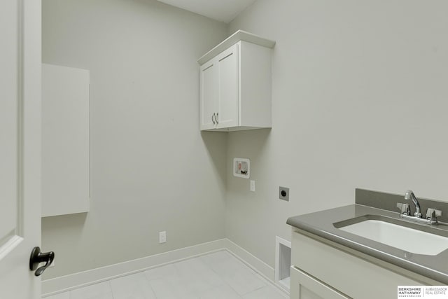 laundry area featuring hookup for a washing machine, electric dryer hookup, sink, and cabinets