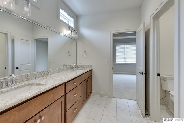 bathroom with vanity and toilet