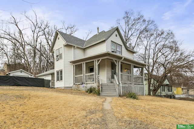 farmhouse inspired home featuring a front yard and covered porch