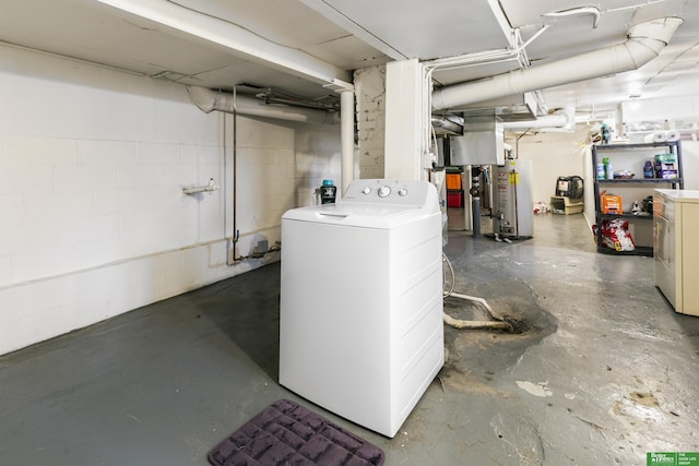 basement featuring gas water heater and washer / dryer